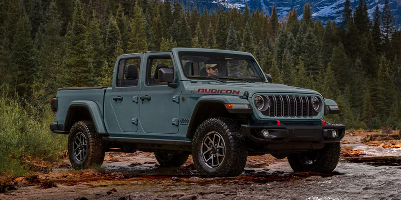 2026 Jeep Gladiator pickup truck in Baytown TX with removable roof and doors, rugged 4x4 capability